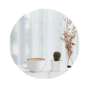 coffe and flowers displayed on counter