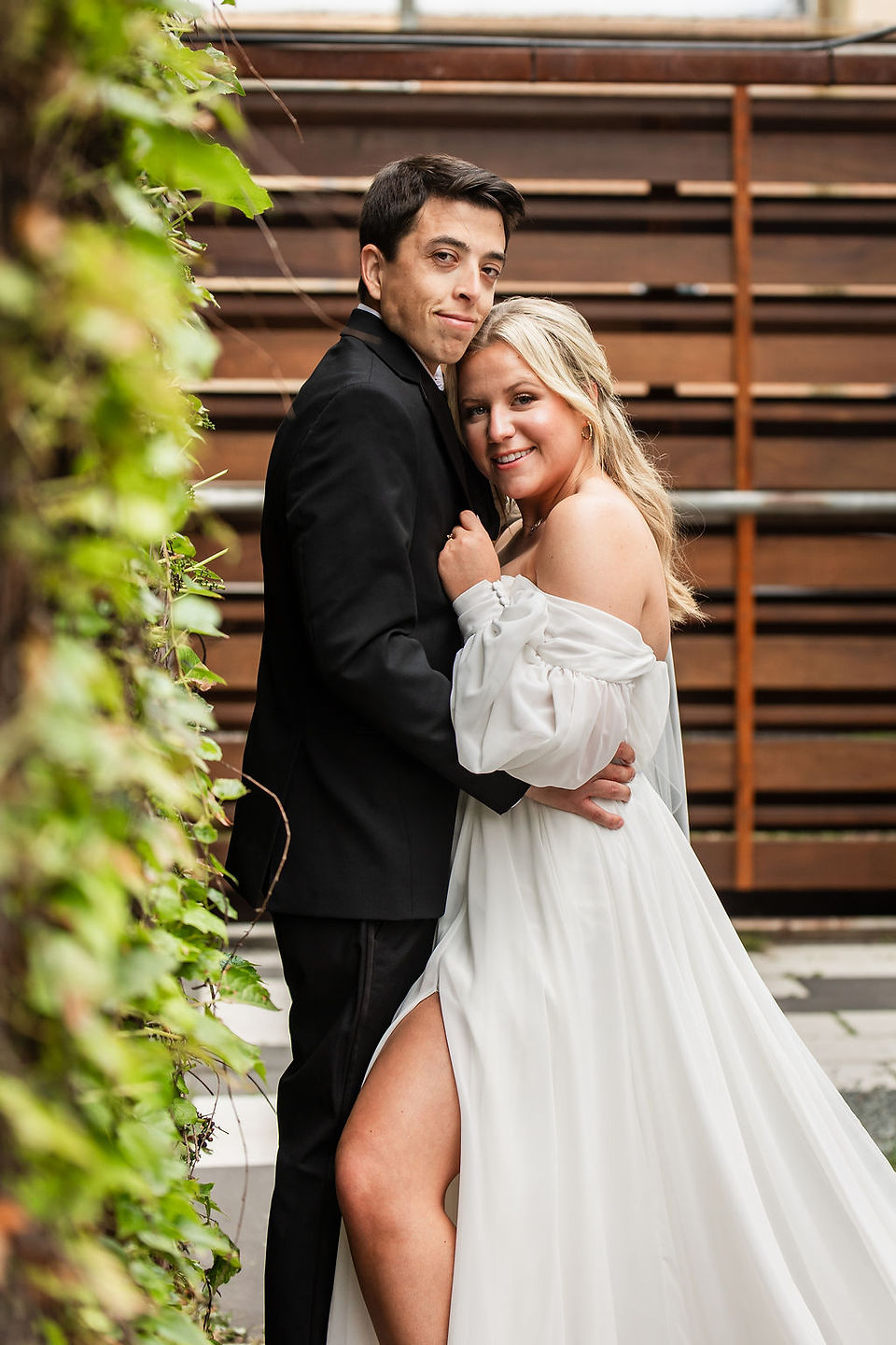Bride and groom cozied up together at the Joinery