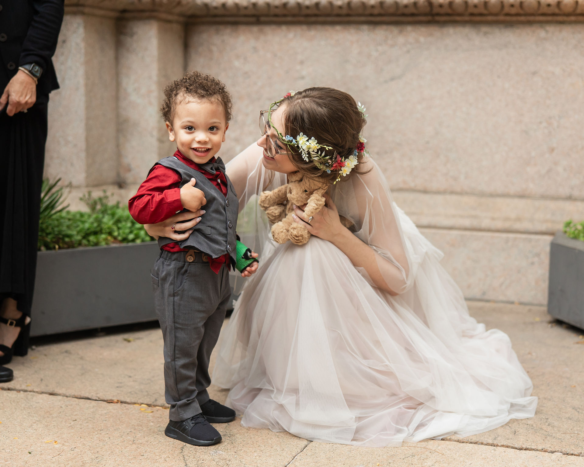 Toddler ring bearer smiling candidly 