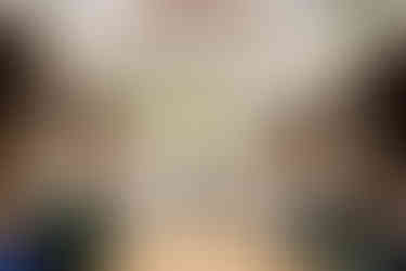 Industrial wedding venue with large skylight, brick walls, greenery hanging from the ceiling. The joinery Chicago IL