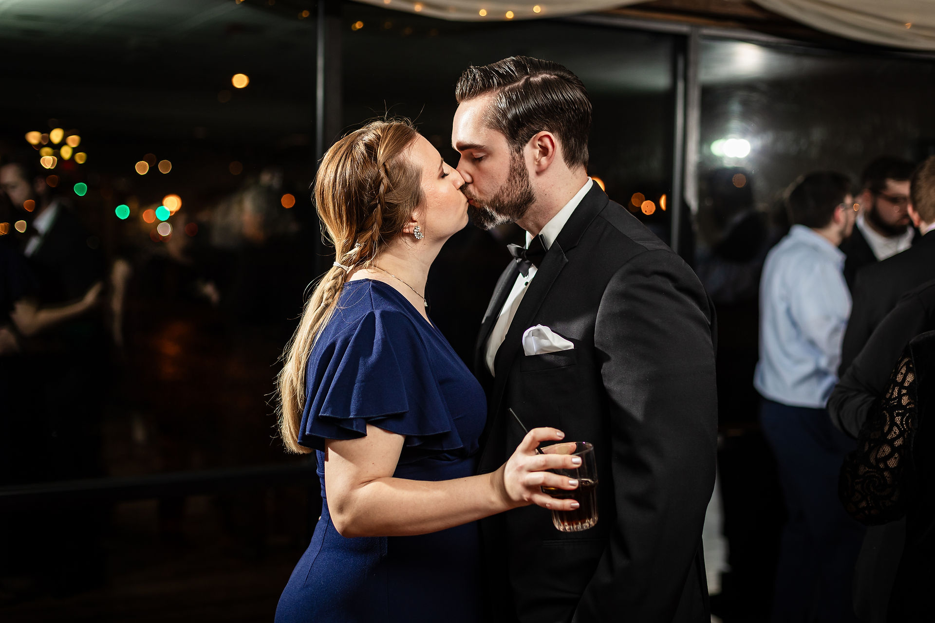 couple kissing on dance floor during slow dance