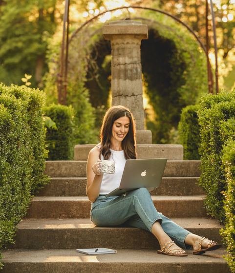 sunset portrait of women writing on laptop