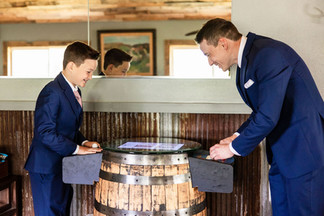 Groom and ring bearer playing games at Heritage Prairie Farm
