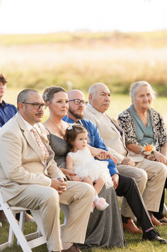 Candid photo of bride's family during wedding ceremony
