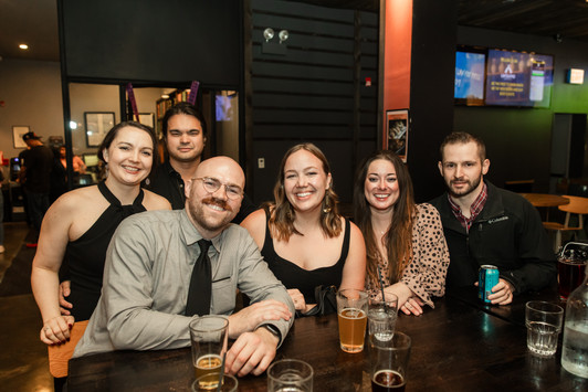 Grip and grin of guests smiling at cocktail hour