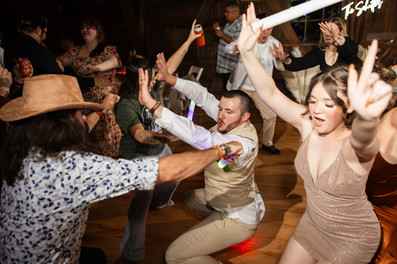Wedding guests partying and having fun on dance floor