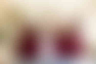 brides and bridesmaids laughing in sunlit vintage room