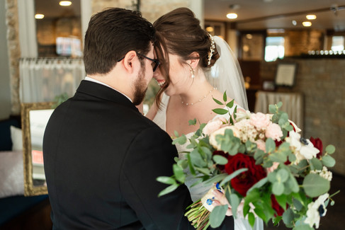 bride and groom touching foreheads