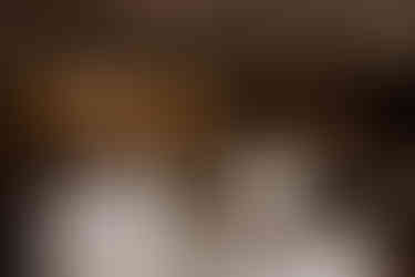 wedding cake with rubik cube cake in dimly lit wedding reception