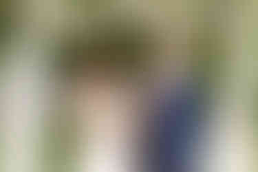 Bride and groom exchanging rings