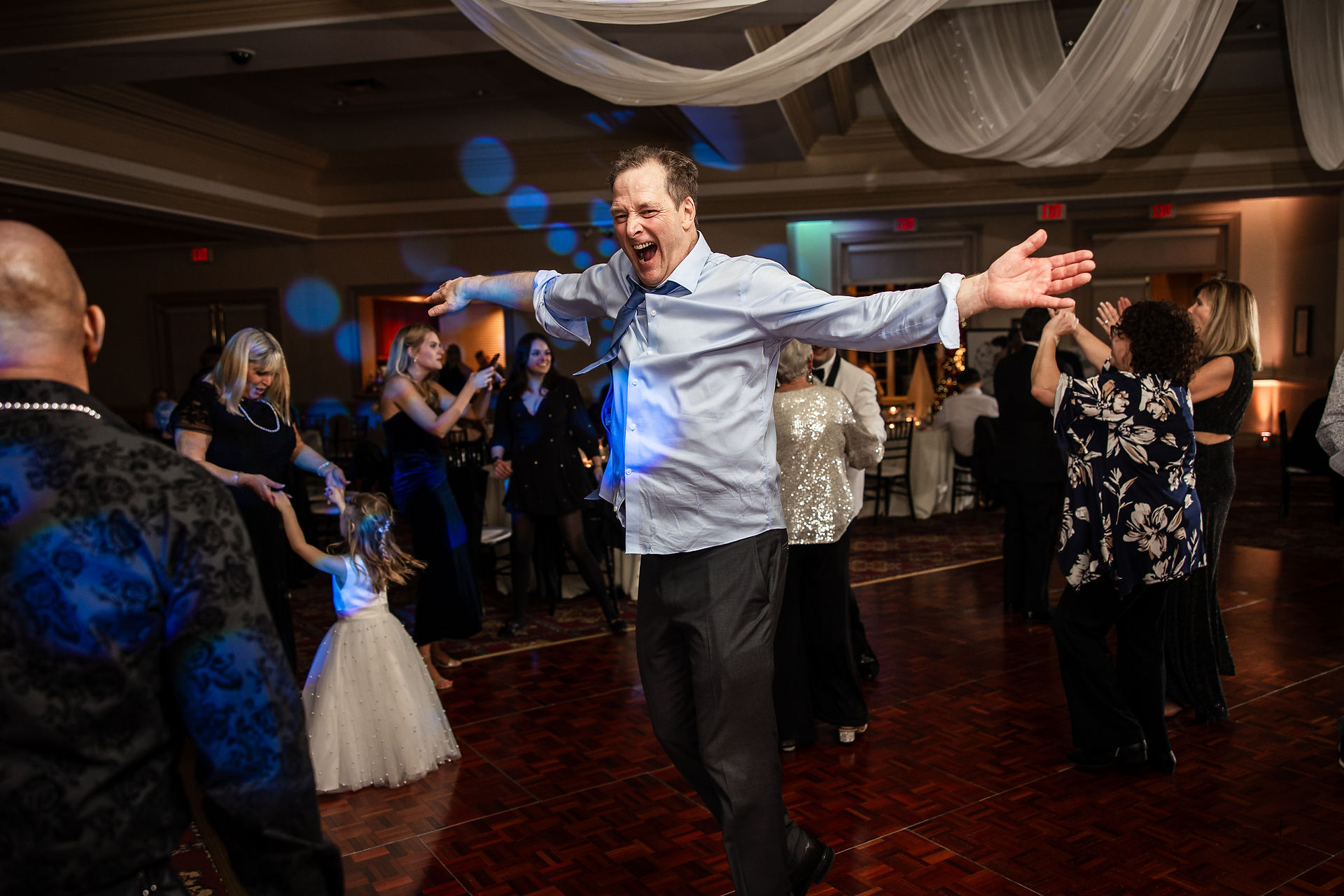 wedding guest dancing lively at wedding reception