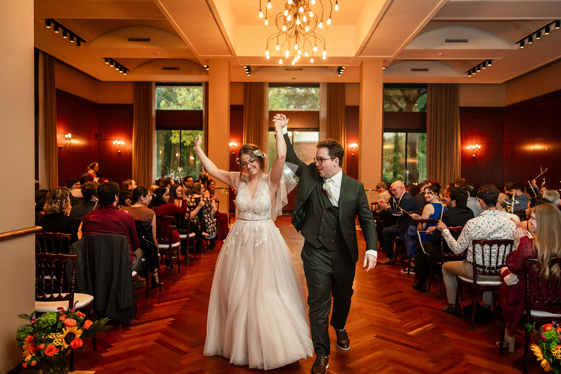 Bride and groom cheer during recessional at Newberry Library