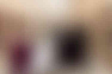 bride and groom running with wedding party hyping them up in a brick industrial setting