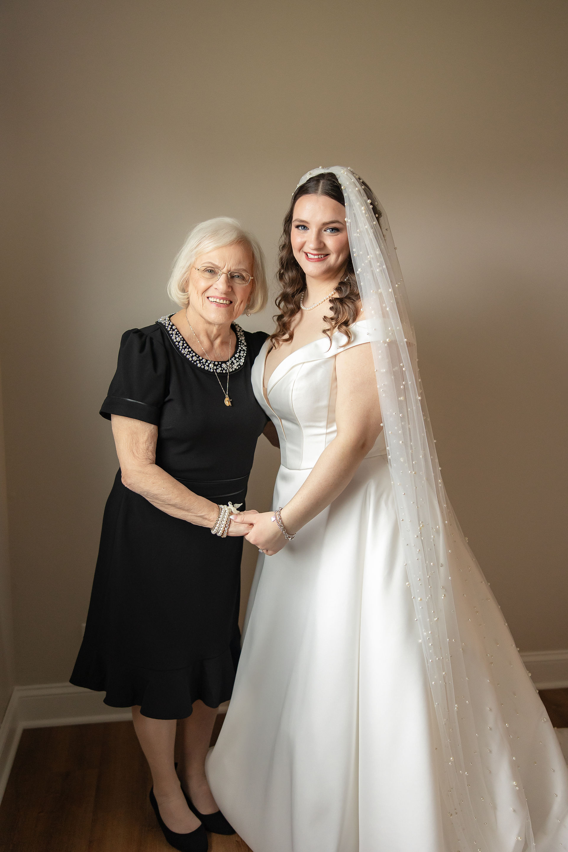 Bride and grandmother posing for a photo