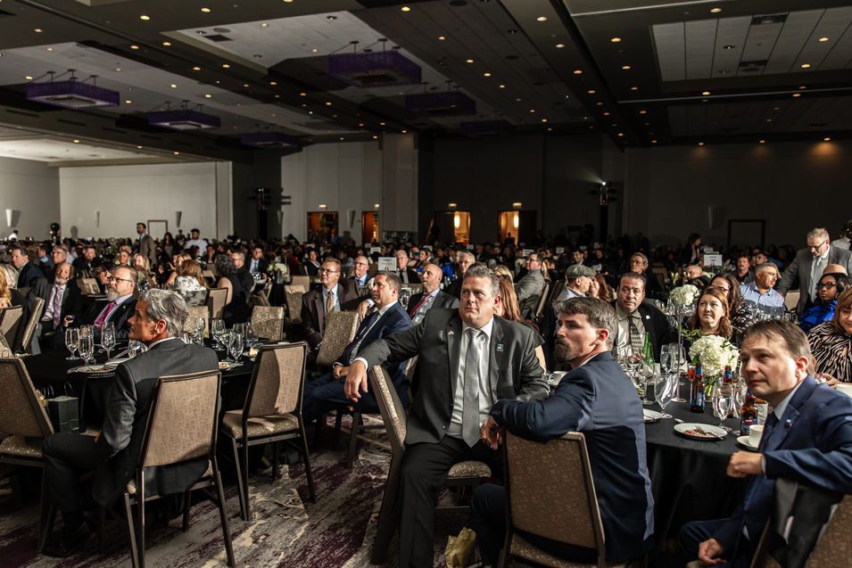 photo of guests listening to speakers at corporate event