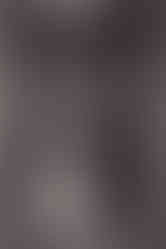 Bride and groom looking at each other in elevator 