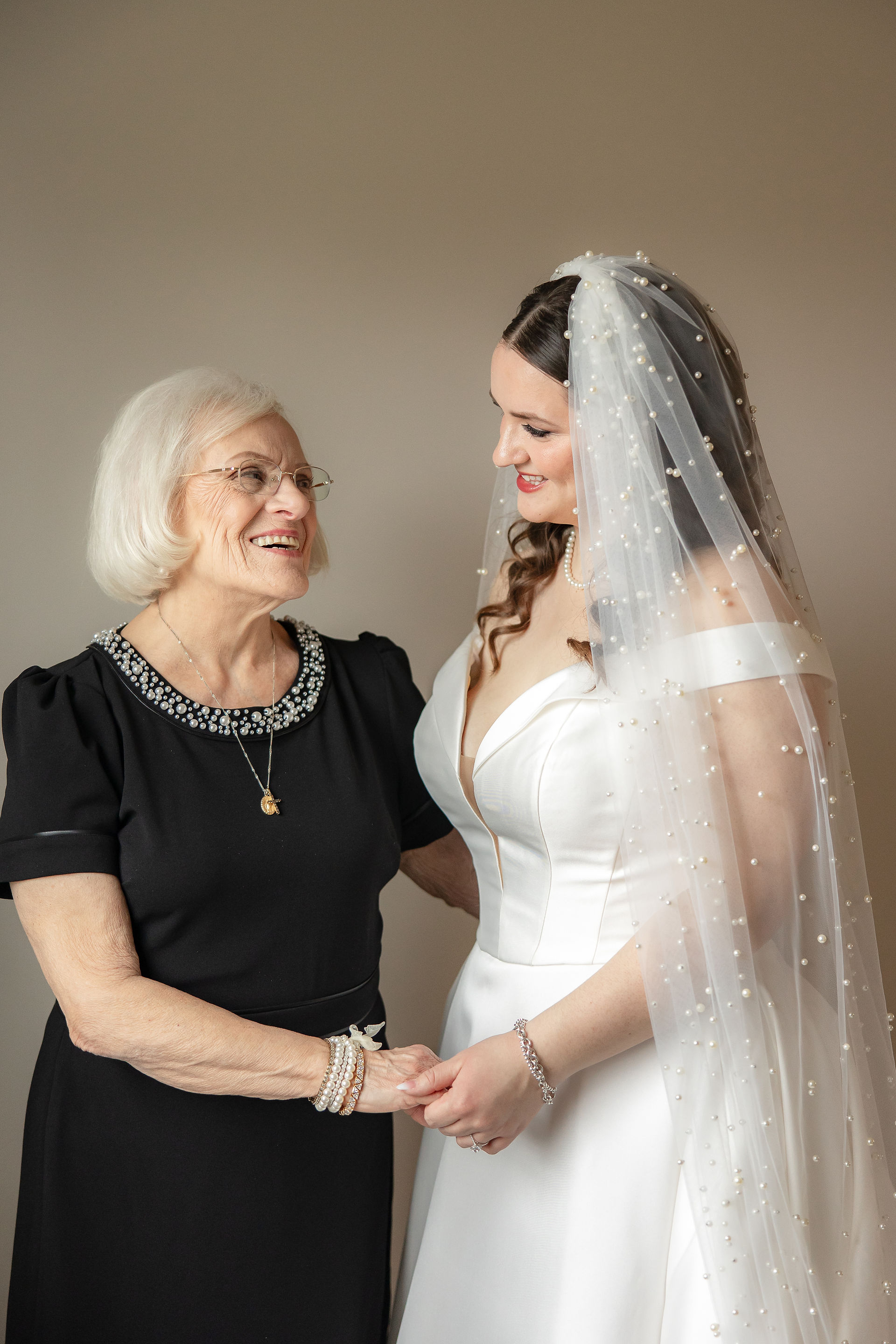 Bride and grandmother looking at eachother