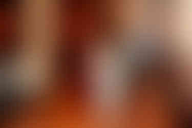 Bride walking down the aisle at Ruggles Hall with both parents