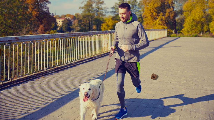 Man Running Away From Where His Dog Just Pooped On Path