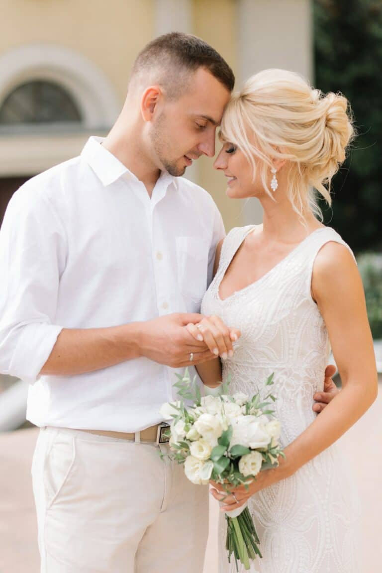 romantic-wedding-couple-embracing-outdoors-on-their-special-day-768x1152.jpg