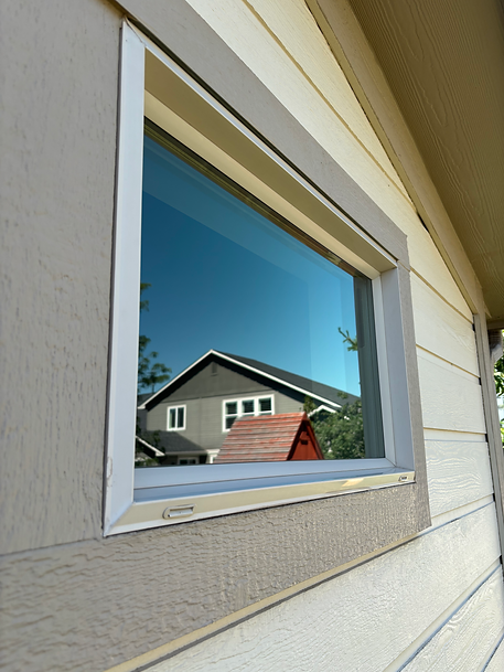 window cleaning Boise home during summer morning