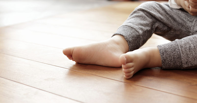 Foot of Baby Boy on Floor