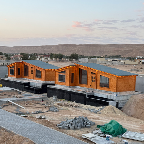Two wooden houses under construction