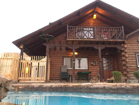 Wooden cabin rental with pool
