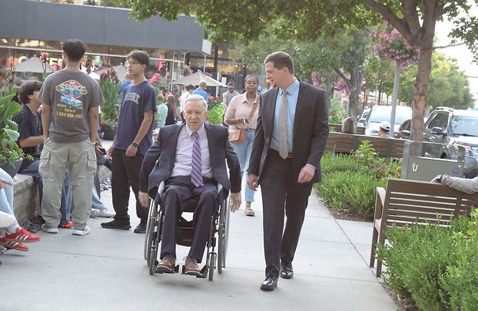 Joe and Dad walking on the sidewalk