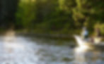A couple of fishermen are fly fishing Moosehead Lake