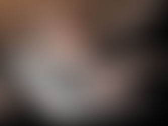 hands typing on a laptop with visual graphics showing social media interactions