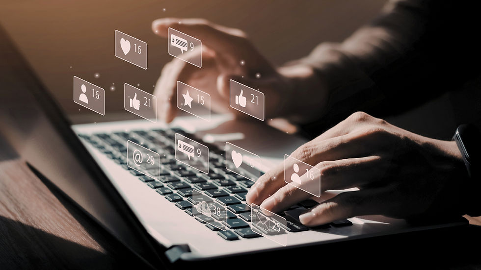 hands typing on a laptop with visual graphics showing social media interactions