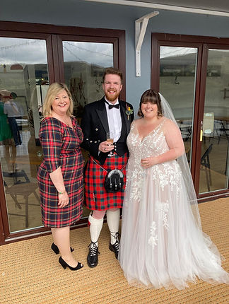 Rhona with a bride and Groom after marrying them