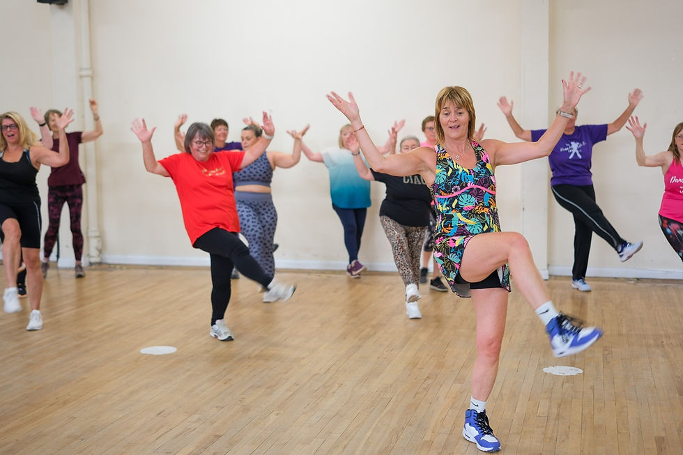 Zumba Gold participants following simple steps in a relaxed session