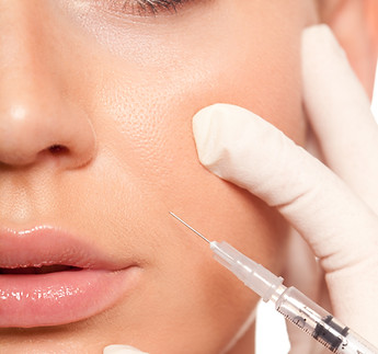 closeup beautiful woman face, syringe injection to nasolabial fold  beauty concept