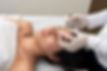 young woman on a table in a beauty center performing a beauty treatment for facial skin wi