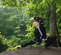 Sifu Bodhi doing qigong in the forest.