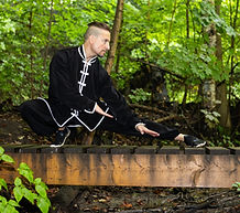 Sifu Bodhi doing qigong in the forest.