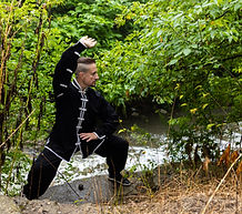 Sifu Bodhi doing qigong in the forest.