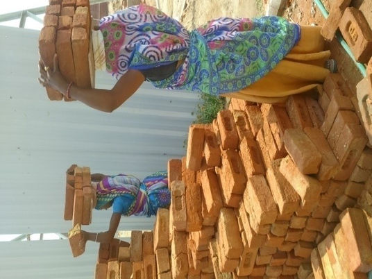 Designing a brick carrying device for improving ergonomics and efficiency of labourers at constructi