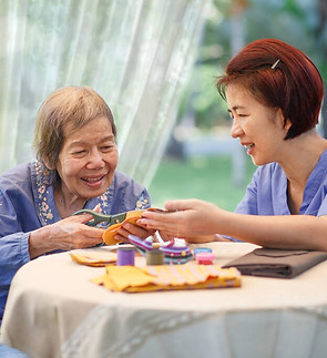 elderly-woman-caregiver-needle-crafts-occupational-therapy-alzheimers-dementia.jpeg