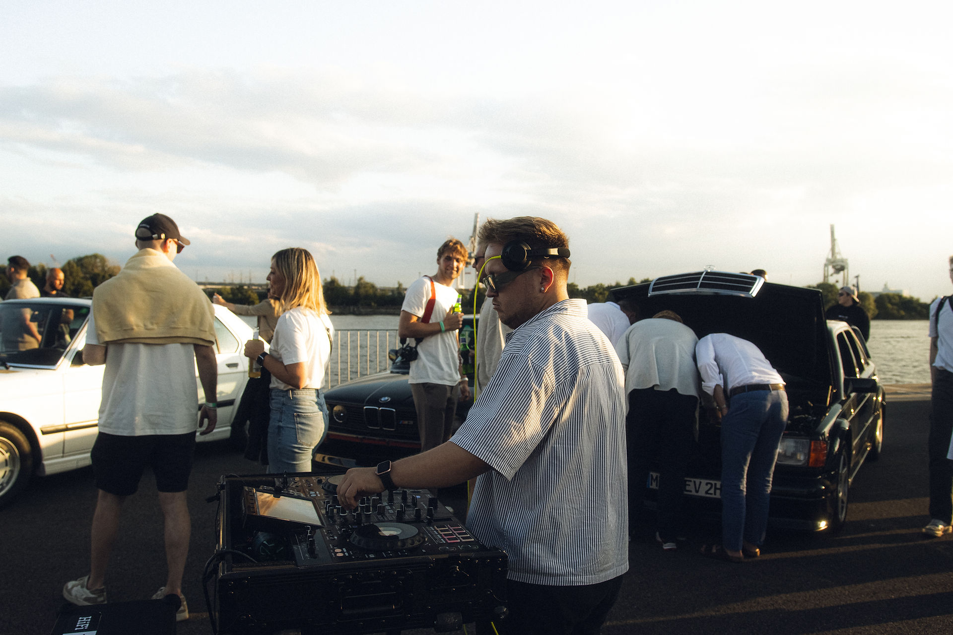 DJ playing his set on the outside in the evening sun