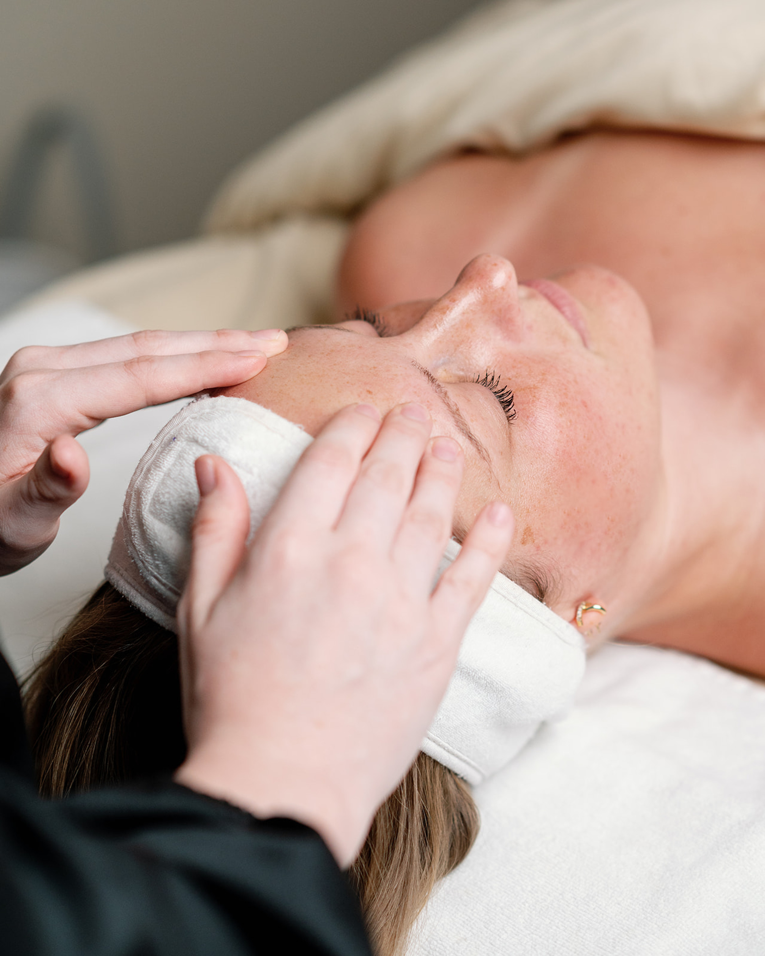 Clean, professional medical spa treatment room with neutral tones at Balance Beauty Spa + Wellness in Columbus