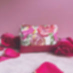 pink floral print fabric coin purse with leather accent bottom