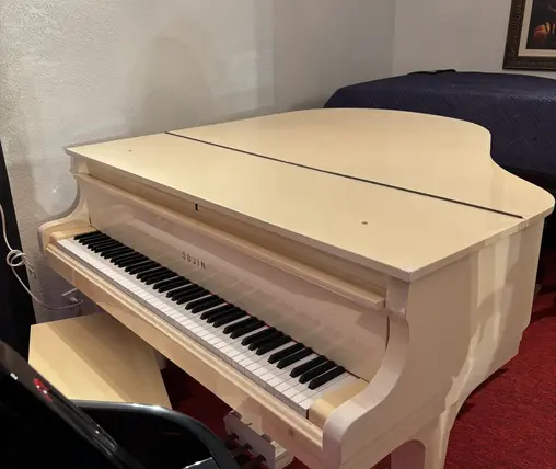 Sojin White Grand Piano keyboard close-up in glossy white finish at Rockafellow Piano in San Antonio, Texas