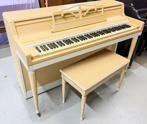 Full front open view of Wurlitzer Spinet piano showing cabinet and finish at Rockafellow Piano in San Antonio, Texas.