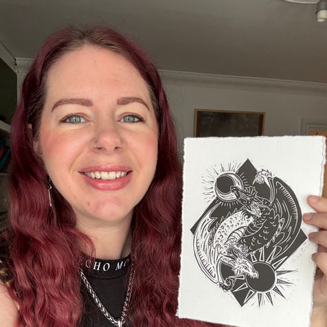 Linocut print of The Sun Dragon and The Moon Dragon