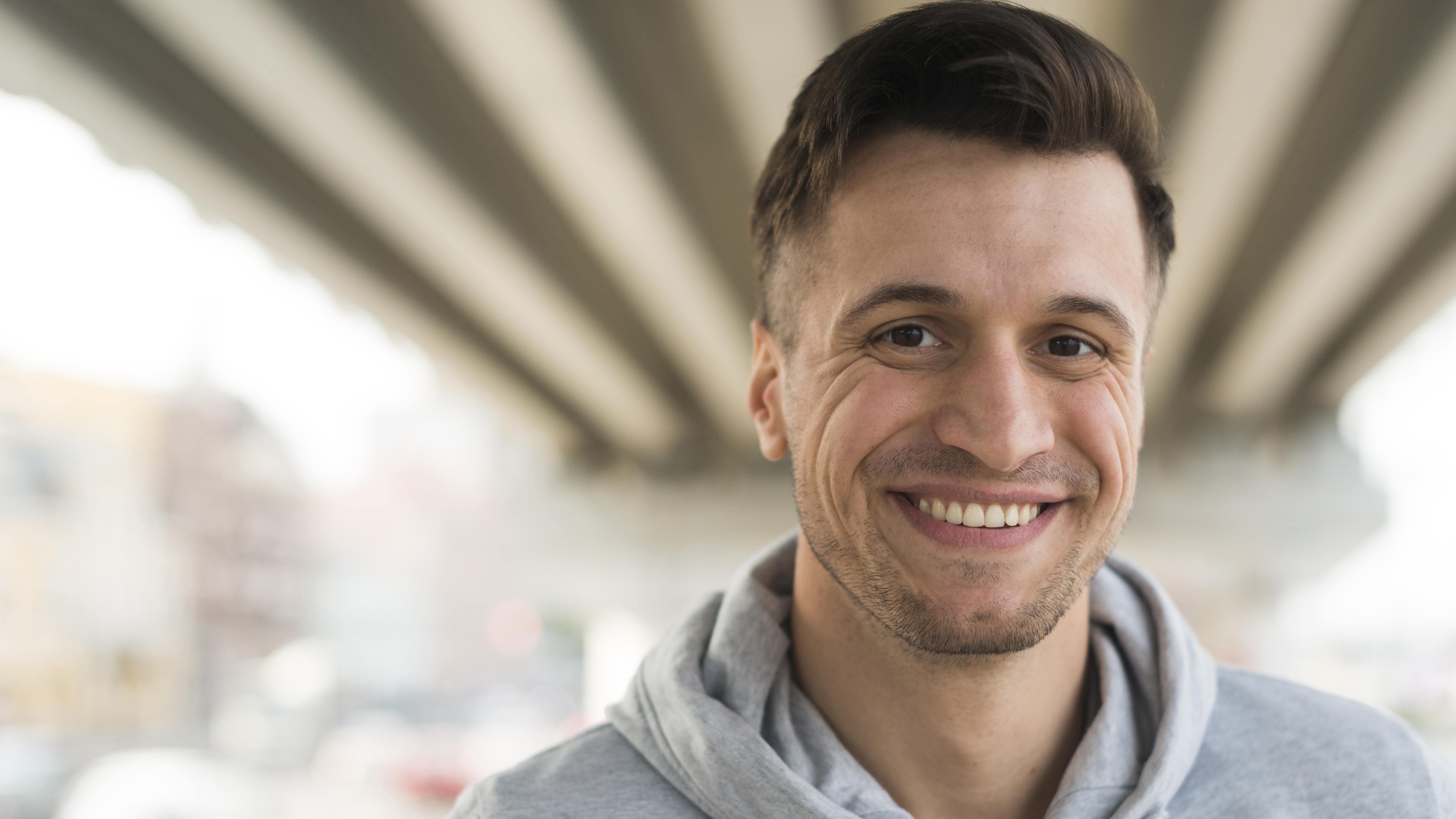 portrait-happy-adult-man-smiling-min.jpg