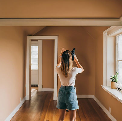 someone taking a picture in a house.jpg