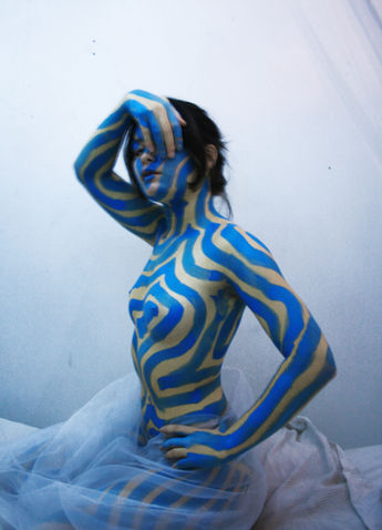Photograph of a girl body painted by The Line Girl in abstract blue lines